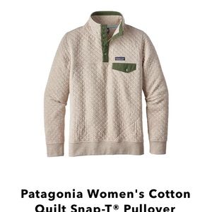 White Patagonia with navy blue collar